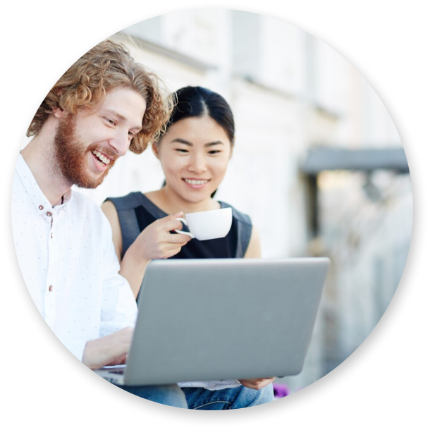 Two people looking at a notebook