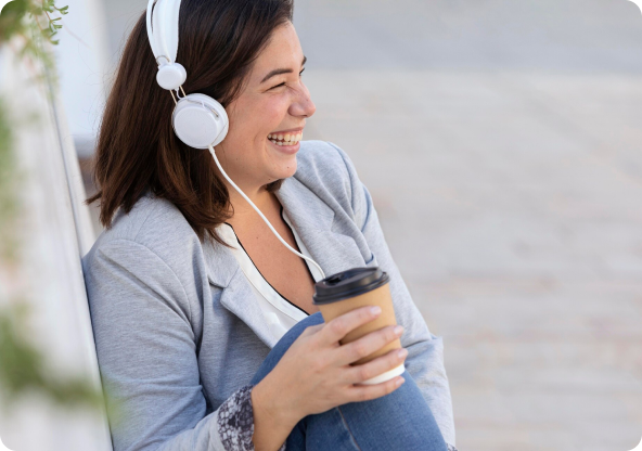A person smiling with headphones