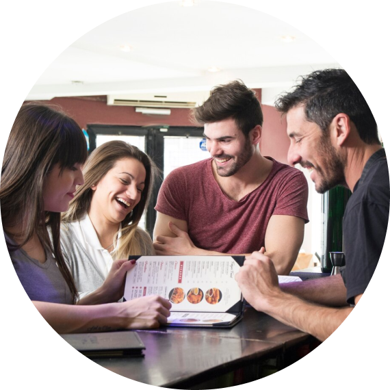 Four people working and talking