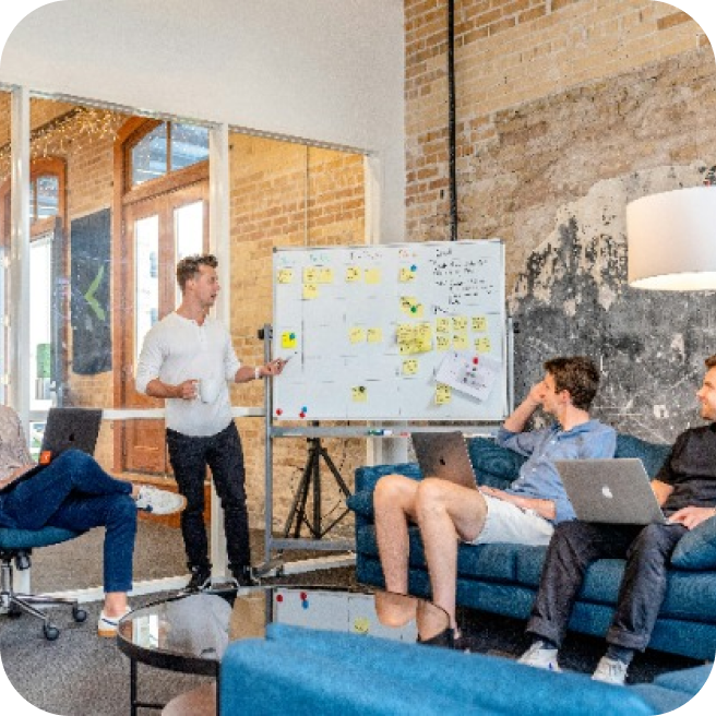 Person presenting their work on a whiteboard
