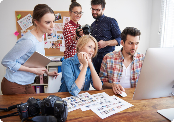 People looking at a notebook