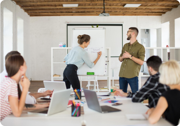 People analyzing a whiteboard