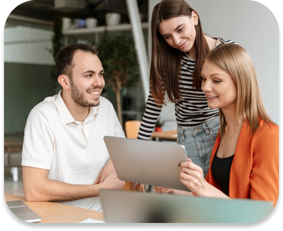 Three people looking at a notebook