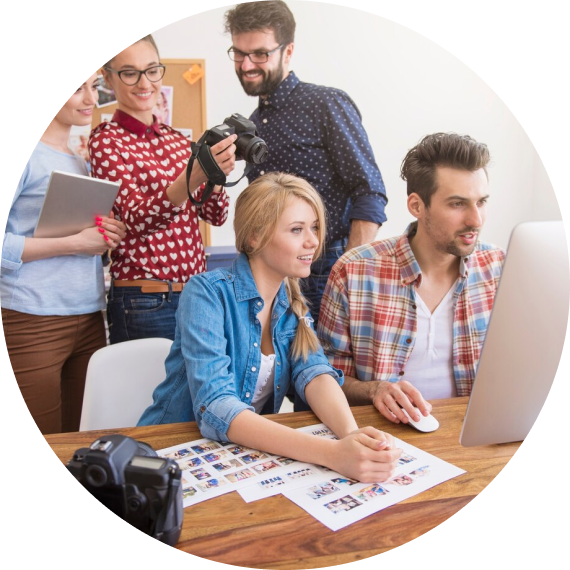 Four people working and a notebook