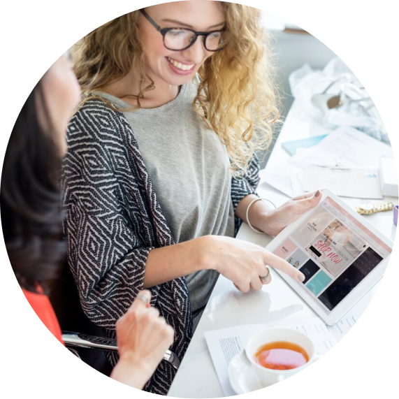 Girl sharing a graph/chart with tables with another girl