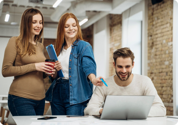 Three people looking at a notebook